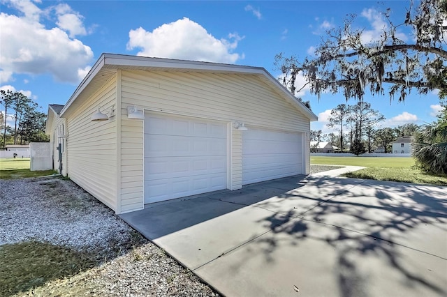 garage with a lawn