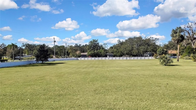 view of property's community with a lawn