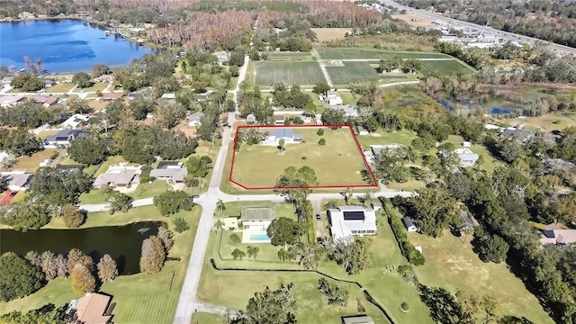 birds eye view of property featuring a water view