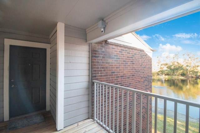 balcony featuring a water view