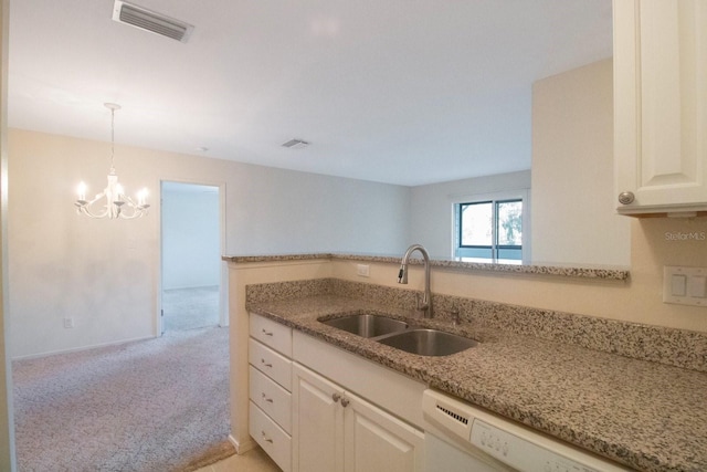 kitchen featuring light carpet, an inviting chandelier, white dishwasher, sink, and white cabinetry