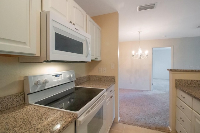 kitchen with light colored carpet, electric range, a chandelier, white cabinetry, and hanging light fixtures