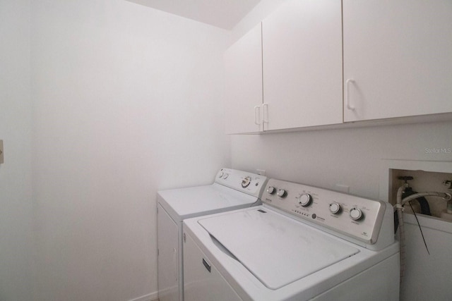 laundry room featuring cabinets and independent washer and dryer