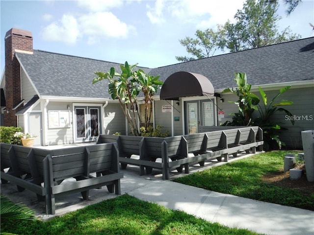 back of house featuring outdoor lounge area and french doors