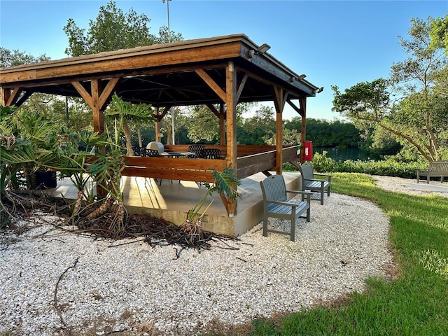 view of home's community with a gazebo and a patio area