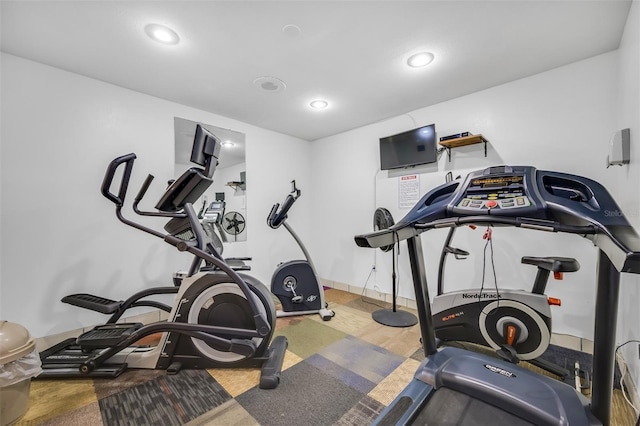 exercise room featuring wood-type flooring