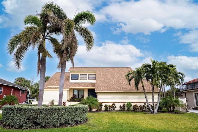 view of front of property with a front lawn