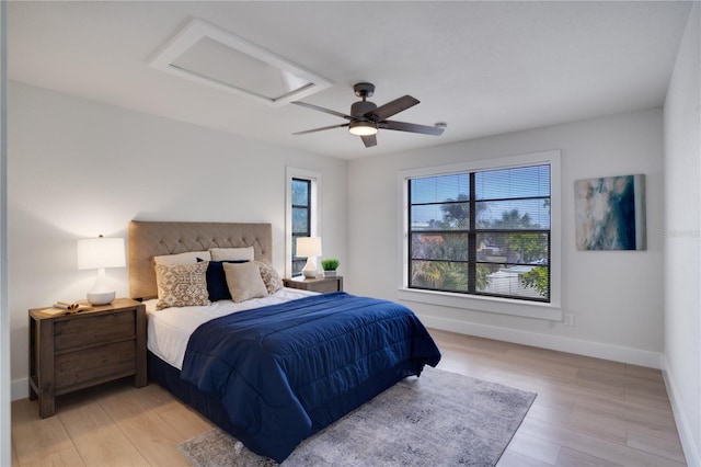 bedroom featuring ceiling fan and light hardwood / wood-style flooring