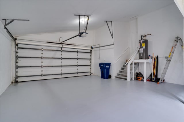 garage with electric water heater and a garage door opener