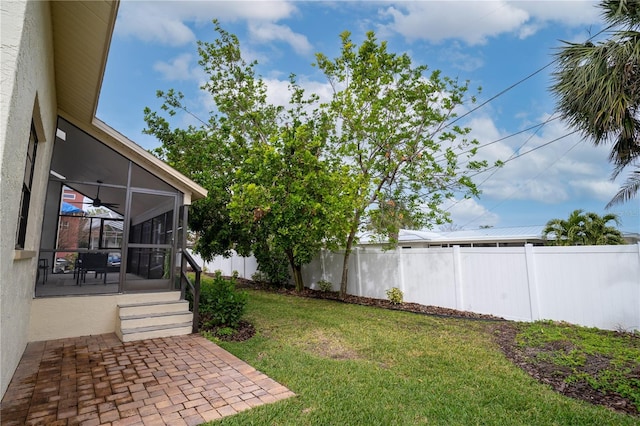 view of yard with a patio and a sunroom