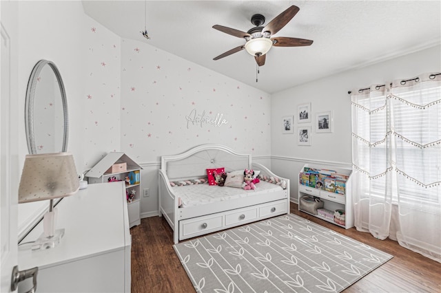 bedroom featuring a textured ceiling, ceiling fan, and dark wood-type flooring