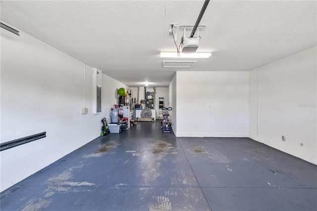 garage with a garage door opener and electric panel