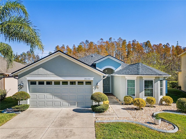 single story home featuring a garage