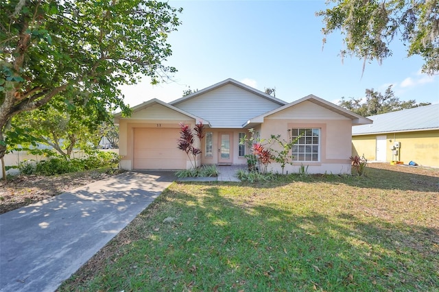 single story home with a garage and a front yard