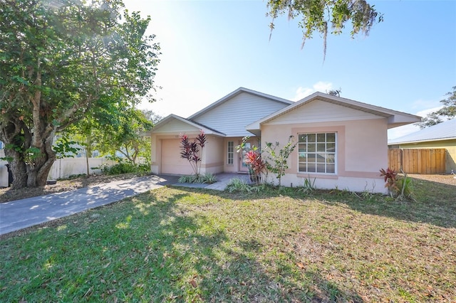 ranch-style home with a front yard and a garage