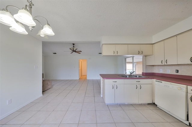 kitchen with ceiling fan, sink, cream cabinets, dishwasher, and hanging light fixtures