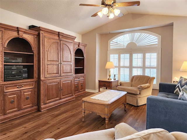 living room with dark hardwood / wood-style floors, ceiling fan, and vaulted ceiling