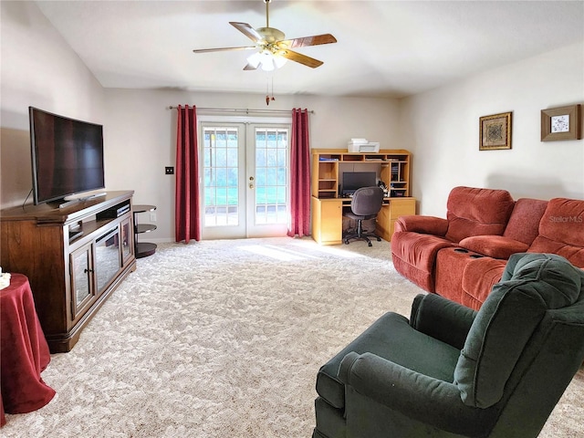 carpeted living room featuring ceiling fan and french doors