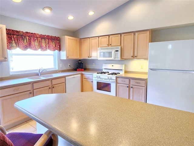 kitchen with white appliances, sink, light brown cabinets, light tile patterned floors, and lofted ceiling