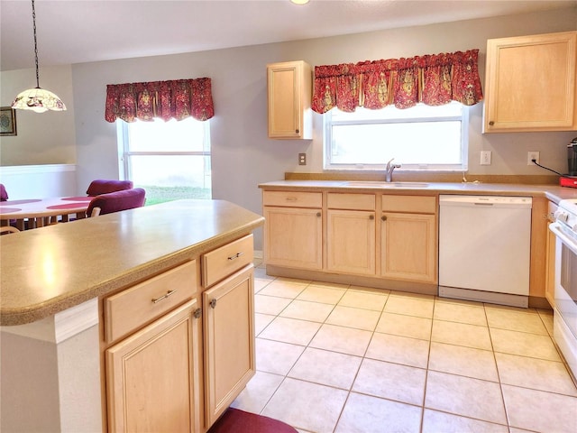 kitchen with pendant lighting, dishwasher, light brown cabinets, sink, and light tile patterned floors