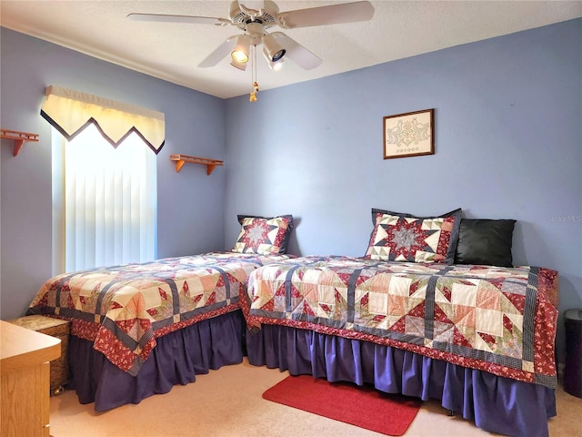 bedroom featuring carpet floors and ceiling fan