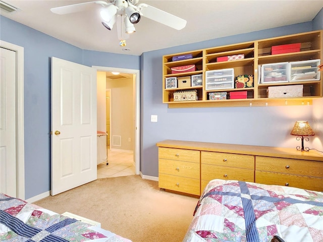 bedroom featuring light colored carpet and ceiling fan