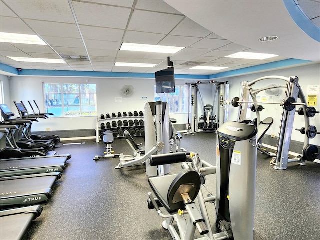 exercise room with a paneled ceiling