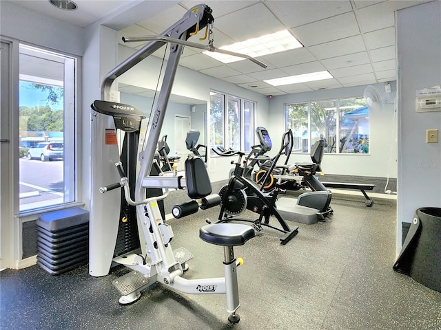 workout area featuring a paneled ceiling