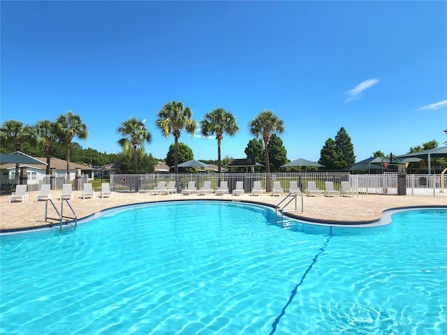 view of swimming pool featuring a patio