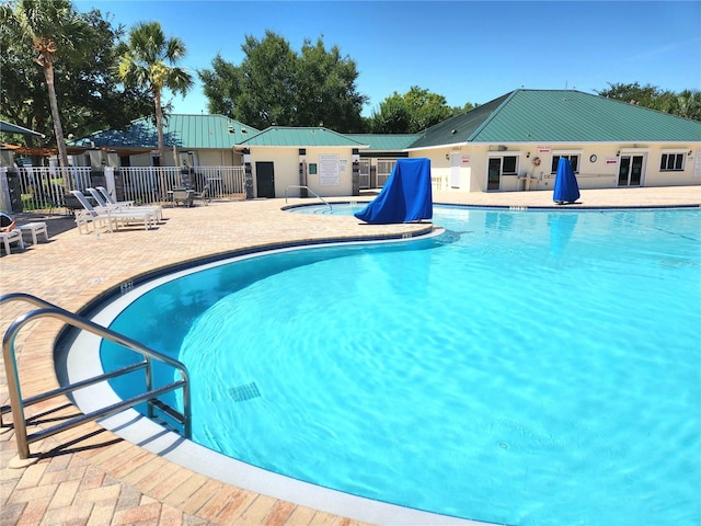 view of swimming pool with a patio area