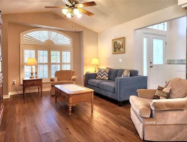 living room with vaulted ceiling, dark hardwood / wood-style floors, and ceiling fan