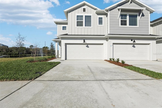 view of front of home featuring a garage and a front lawn