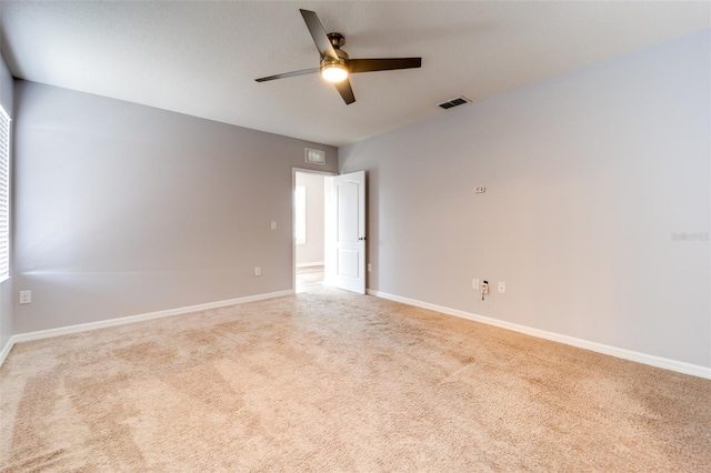 carpeted empty room with ceiling fan