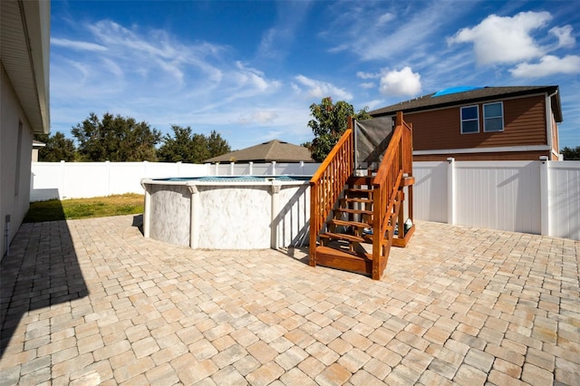 view of patio / terrace featuring a fenced in pool