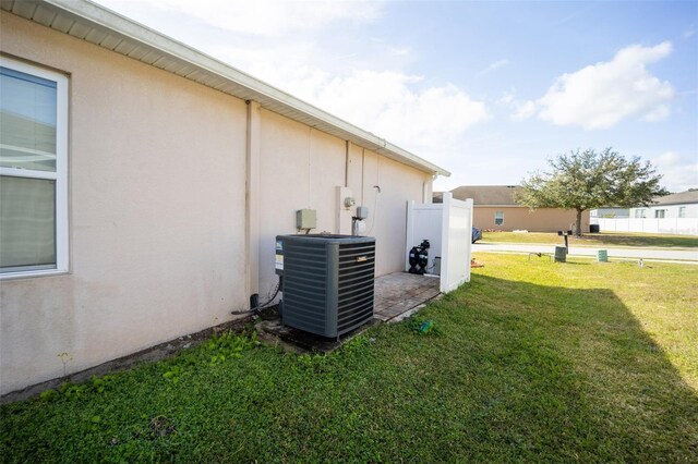 view of yard with central air condition unit