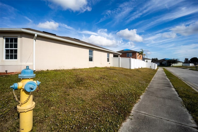 view of home's exterior featuring a lawn