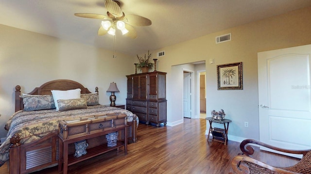 bedroom featuring ceiling fan and dark hardwood / wood-style flooring