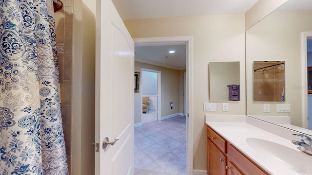 bathroom featuring a shower with shower curtain, vanity, tile patterned floors, and ornamental molding