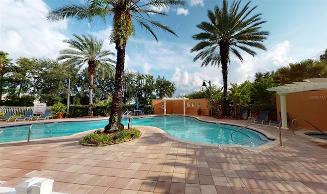 view of swimming pool featuring a patio area