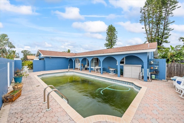 view of swimming pool with a patio