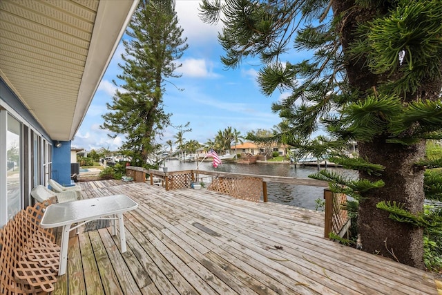 wooden deck featuring a water view