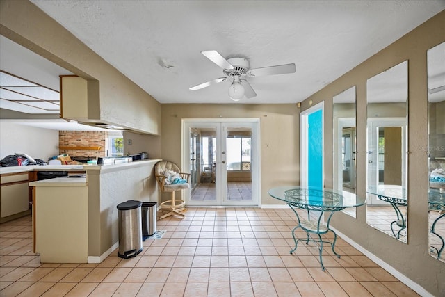 kitchen featuring ceiling fan, light tile patterned flooring, and french doors