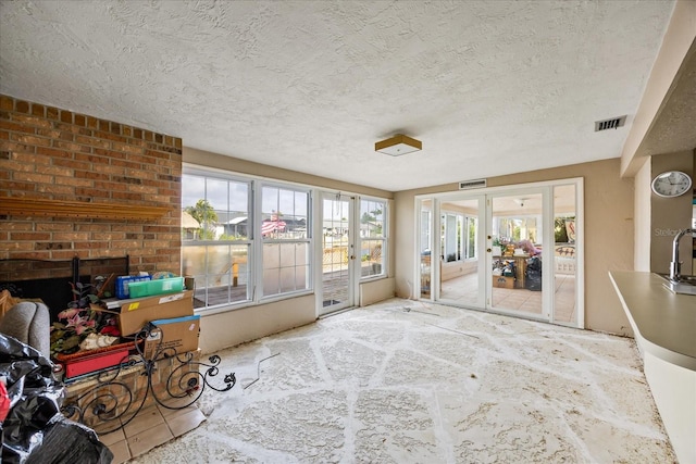 sunroom with a fireplace