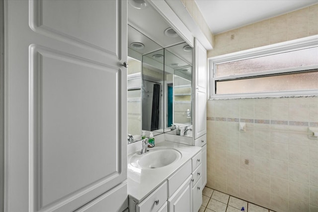 bathroom featuring tile patterned flooring and vanity