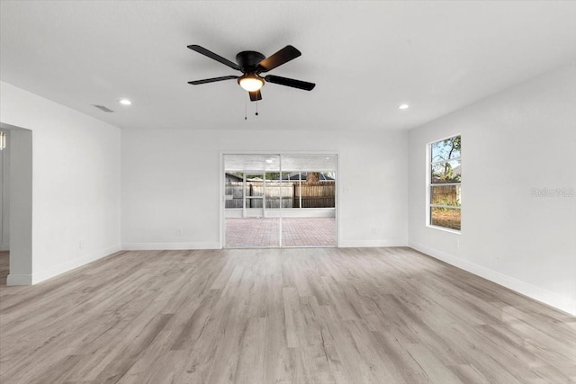 unfurnished living room featuring ceiling fan and light hardwood / wood-style floors