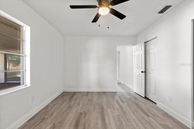 empty room with light hardwood / wood-style floors