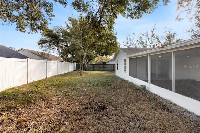 view of yard featuring a sunroom