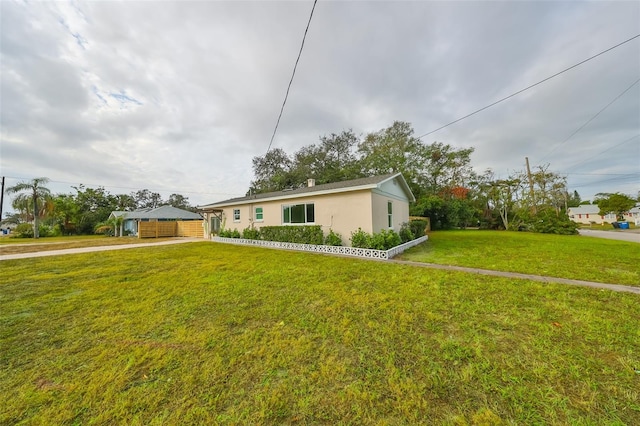 ranch-style house with a front lawn