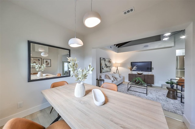 dining space featuring light hardwood / wood-style flooring