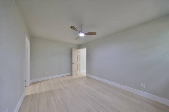 unfurnished room featuring light hardwood / wood-style floors and ceiling fan